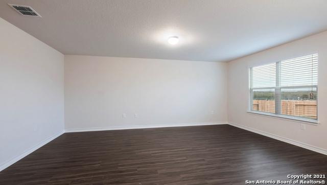 14610 Clay Ridge Run, San Antonio, TX 78253 - spare room with baseboards, dark wood-style flooring, and visible vents