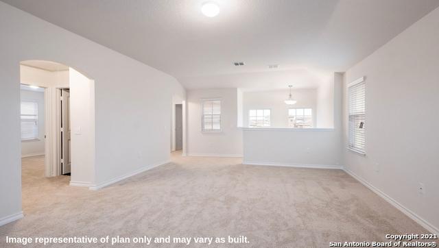 14610 Clay Ridge Run, San Antonio, TX 78253 - carpeted empty room featuring baseboards, arched walkways, and visible vents