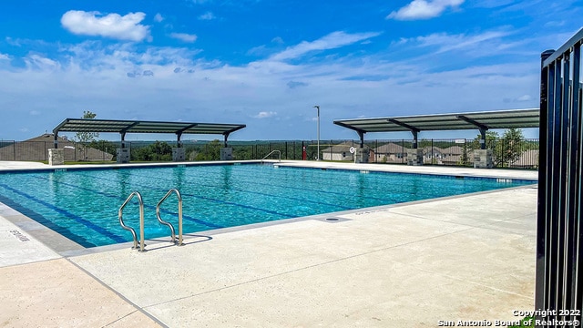 14610 Clay Ridge Run, San Antonio, TX 78253 - community pool featuring a patio and fence