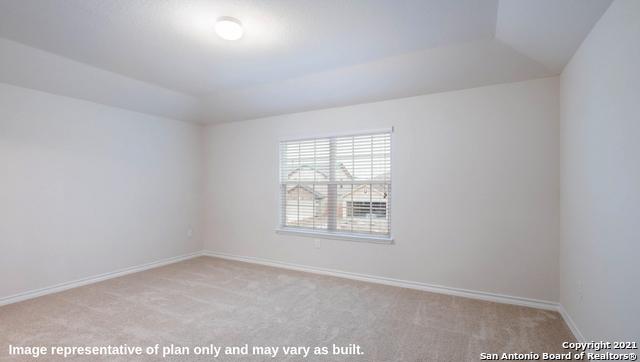 14610 Clay Ridge Run, San Antonio, TX 78253 - carpeted spare room featuring baseboards and vaulted ceiling