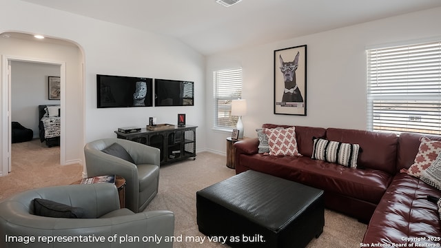 carpeted living room featuring arched walkways, baseboards, vaulted ceiling, and visible vents