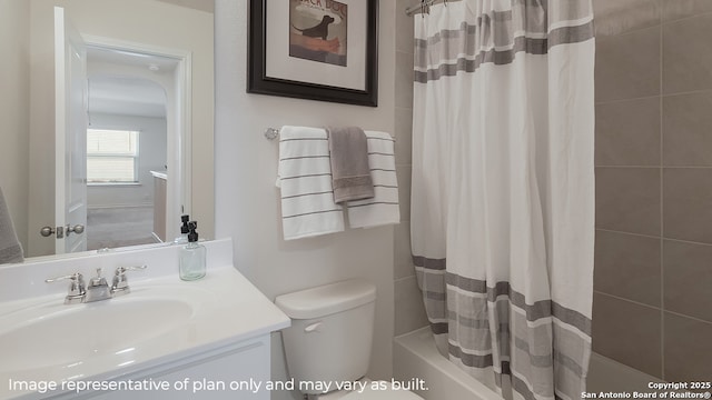 full bathroom featuring toilet, shower / tub combo with curtain, and vanity