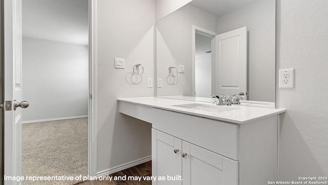 bathroom with vanity and baseboards