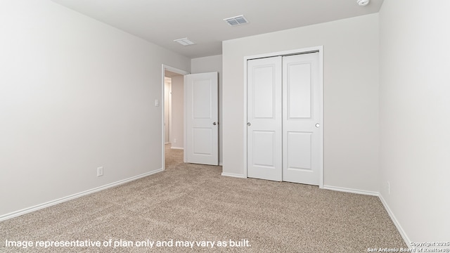 unfurnished bedroom featuring carpet flooring, baseboards, and visible vents