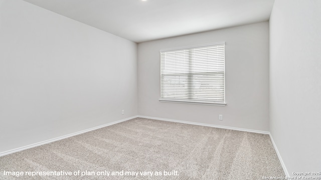 unfurnished room with carpet floors and baseboards