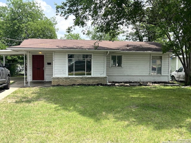 single story home featuring a front yard and a carport
