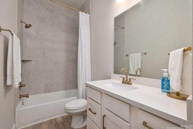 bathroom featuring vanity, shower / tub combo, wood finished floors, and toilet