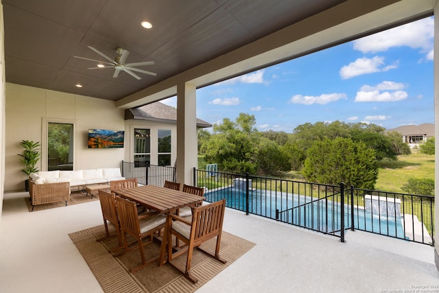 view of patio with a fenced in pool, a ceiling fan, and outdoor lounge area
