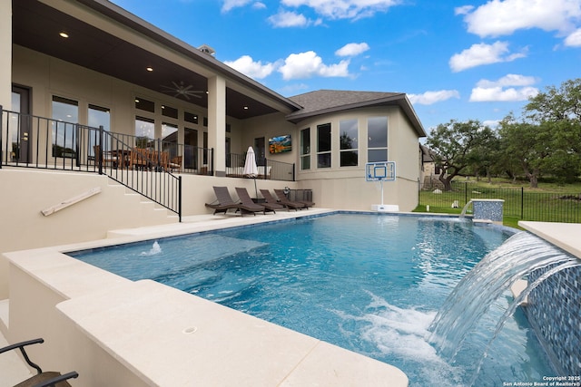 view of swimming pool with a patio, ceiling fan, fence, and a fenced in pool