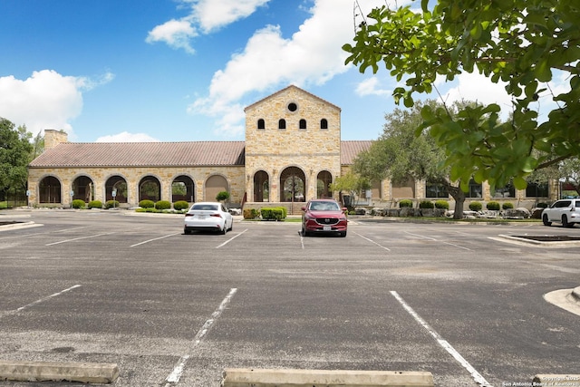 view of property with uncovered parking