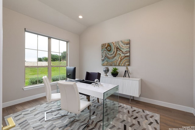 office area featuring baseboards, recessed lighting, vaulted ceiling, and hardwood / wood-style flooring