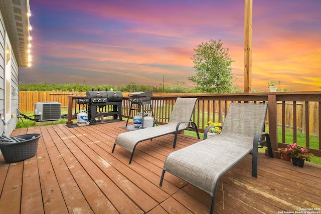 wooden terrace with central air condition unit and fence