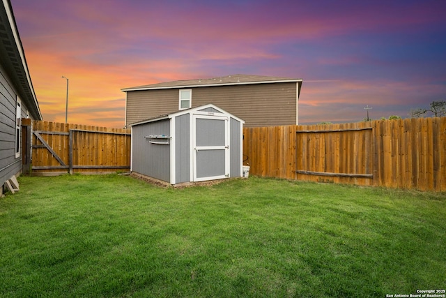 view of shed with a fenced backyard