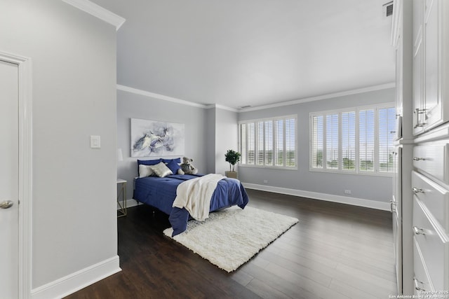 bedroom with baseboards, dark wood-style flooring, crown molding, and visible vents