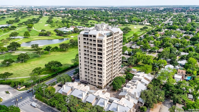 bird's eye view featuring view of golf course and a water view