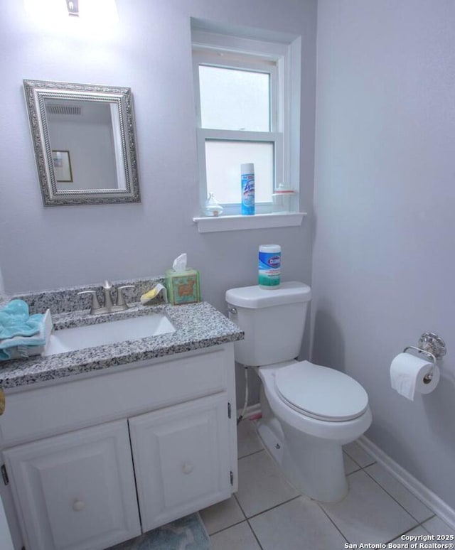 11402 Mission Trace St, San Antonio, TX 78230 - bathroom featuring toilet, baseboards, tile patterned floors, and vanity