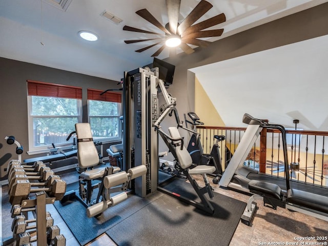 exercise room with visible vents and ceiling fan