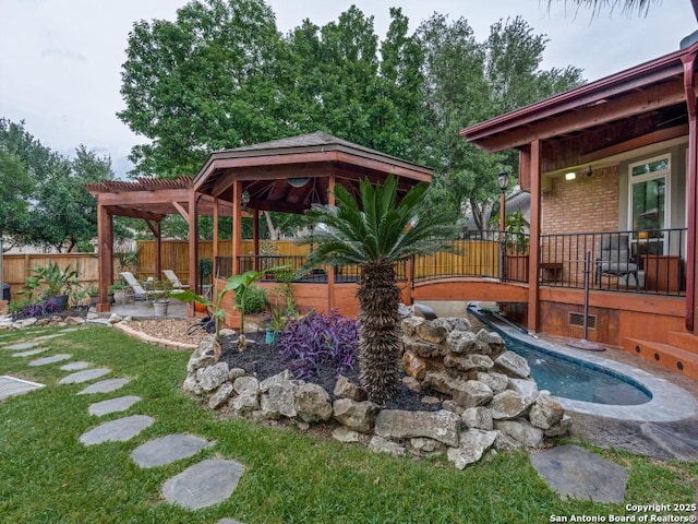 view of yard with a pergola, fence, and a patio