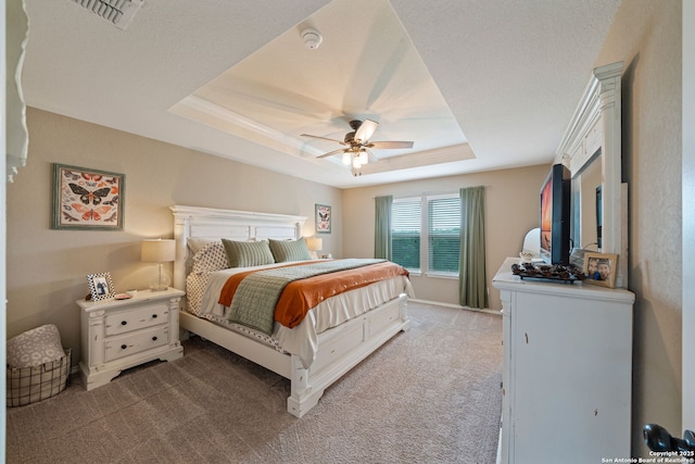27342 Emilie Cyn, San Antonio, TX 78260 - carpeted bedroom featuring a raised ceiling, ceiling fan, and visible vents