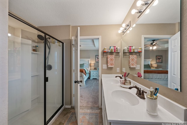 27342 Emilie Cyn, San Antonio, TX 78260 - bathroom with a sink, ensuite bathroom, a shower stall, and ceiling fan