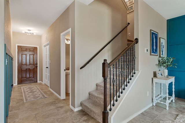 27342 Emilie Cyn, San Antonio, TX 78260 - foyer entrance with baseboards, stairs, and visible vents