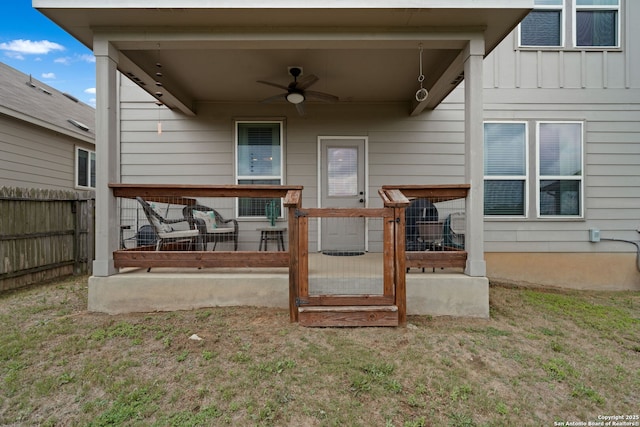 27342 Emilie Cyn, San Antonio, TX 78260 - back of property with a lawn, a ceiling fan, board and batten siding, and fence