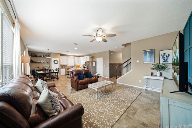 27342 Emilie Cyn, San Antonio, TX 78260 - living area with stairs, ceiling fan, and baseboards