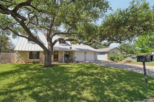 ranch-style house with a garage, fence, aphalt driveway, and stone siding