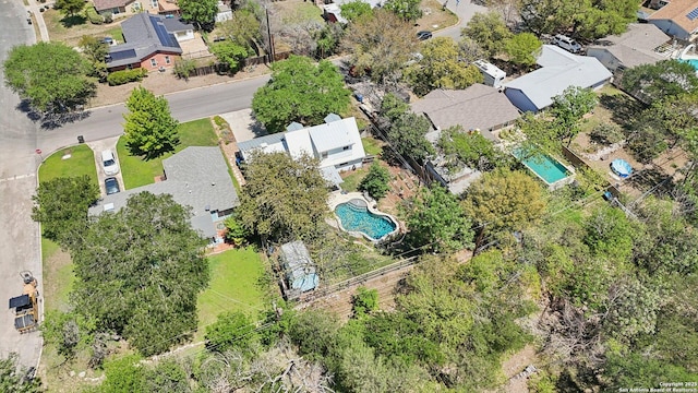 birds eye view of property with a residential view