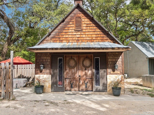 view of outdoor structure featuring fence