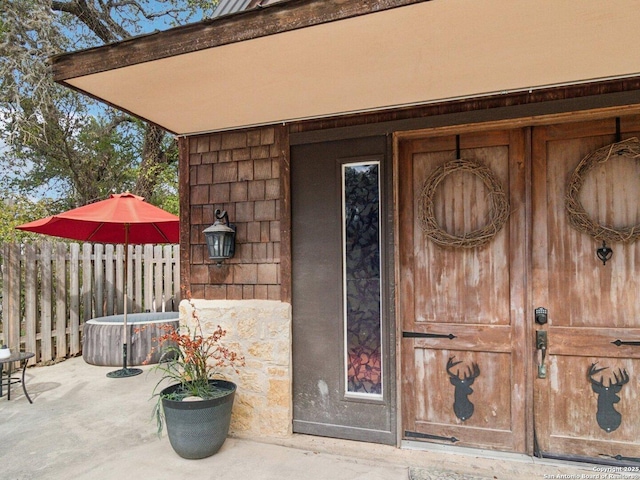 doorway to property with fence