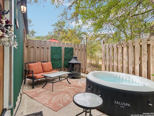 view of patio featuring an outdoor living space and fence