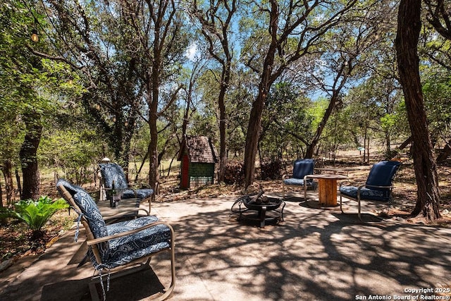 view of patio / terrace with an outdoor fire pit