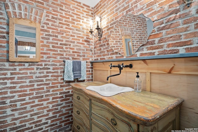 details with a sink and brick siding