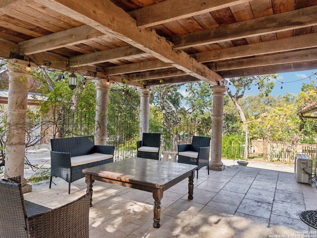 view of patio featuring fence and outdoor lounge area