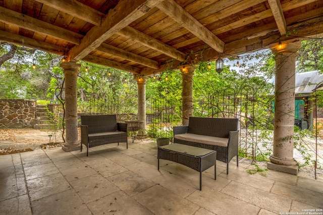 view of patio / terrace with outdoor lounge area and fence