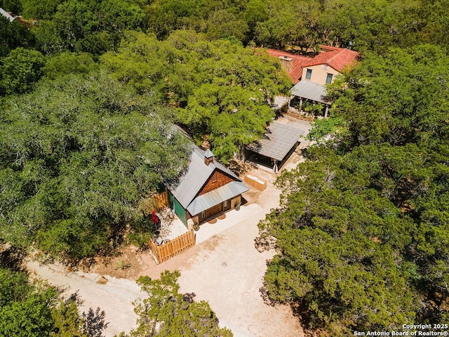 drone / aerial view with a view of trees