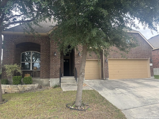 12606 Ozona, San Antonio, TX 78245 - view of front facade featuring brick siding, an attached garage, and concrete driveway