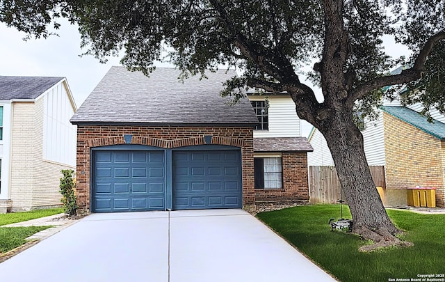 view of front of property with brick siding, a garage, roof with shingles, and concrete driveway