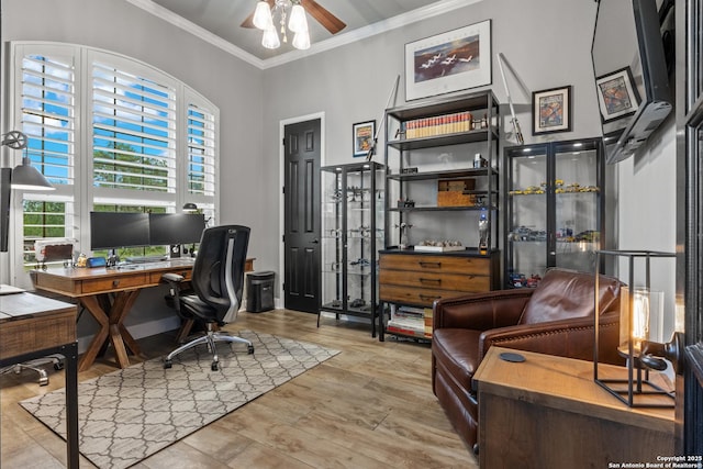 home office featuring crown molding, ceiling fan, and wood finished floors
