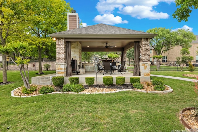 exterior space featuring fence and a ceiling fan