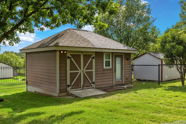 view of shed with fence
