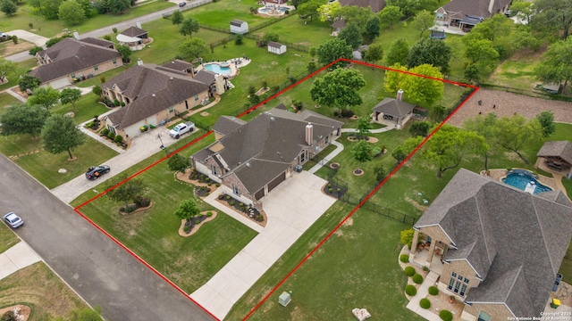 birds eye view of property with a residential view