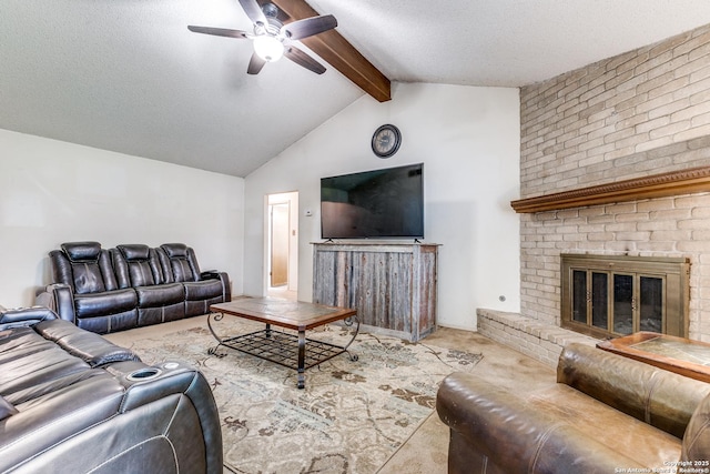 carpeted living area with a textured ceiling, lofted ceiling with beams, a ceiling fan, and a brick fireplace