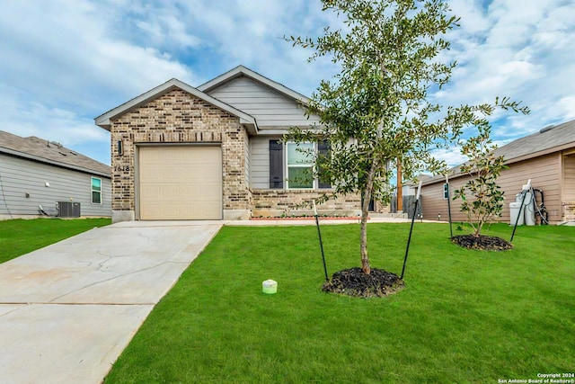 view of front of house with a front yard, brick siding, central AC unit, concrete driveway, and an attached garage
