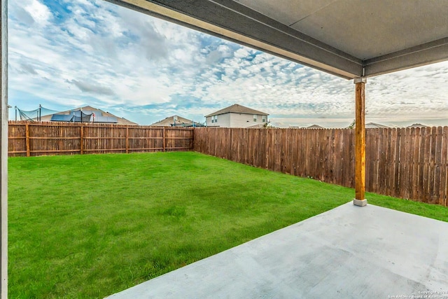 view of yard with a fenced backyard and a patio