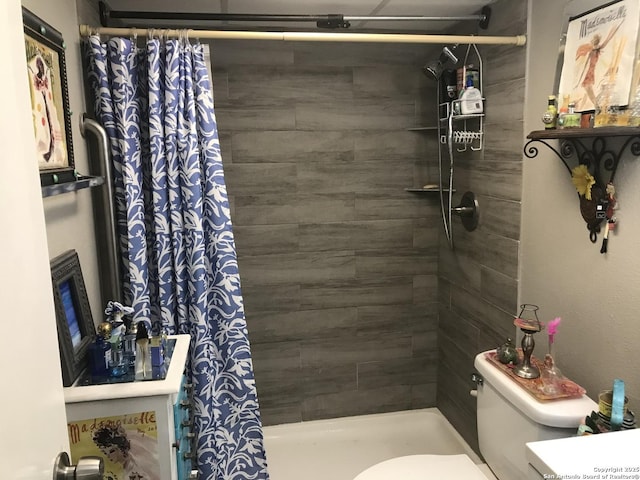 7039 San Pedro Unit 810, San Antonio, TX 78216 - bathroom featuring a stall shower and toilet