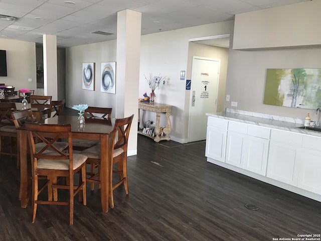 7039 San Pedro Unit 810, San Antonio, TX 78216 - dining space with baseboards, visible vents, and dark wood-type flooring