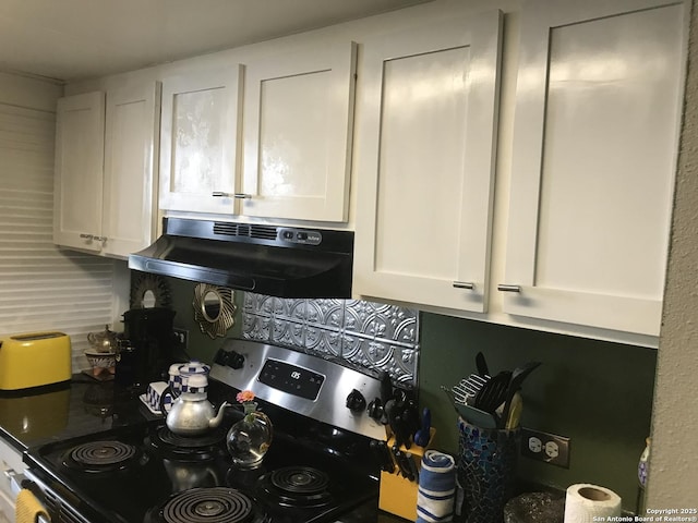 7039 San Pedro Unit 810, San Antonio, TX 78216 - kitchen featuring under cabinet range hood, white cabinetry, and stainless steel stove
