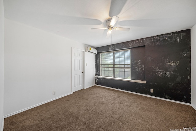 unfurnished room with carpet floors, a wall mounted air conditioner, baseboards, and a ceiling fan